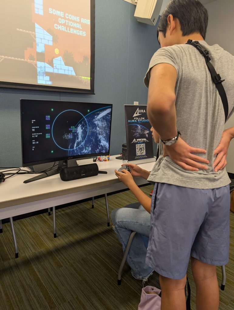 A person observing someone playing Aurora Sol